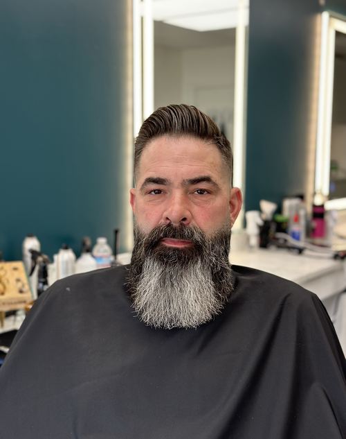 Men's haircut with a full styled beard trim