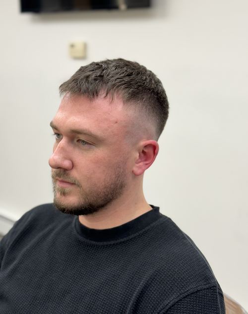 Short crop haircut with a clean skin fade